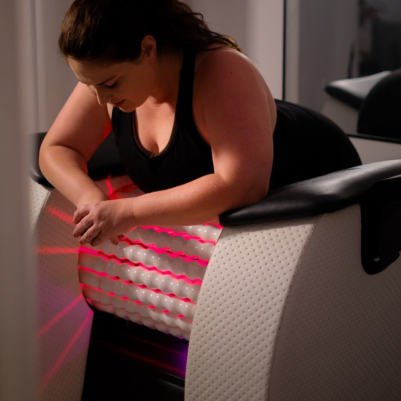 A guest using the Body Roll at Embod East Brisbane